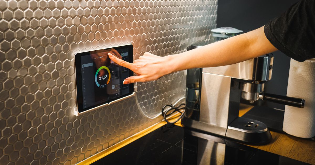 A modern, tech-enabled hotel room with ambient lighting